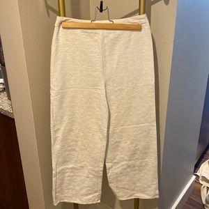 White flare pants with floral pattern. Zipper in the back.